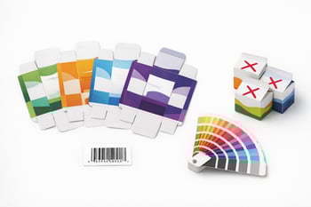 A photorealistic image of packaging proof revisions displayed on a white background Include several slightly different carton proofs fanned out side b
