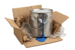 photographic Photorealistic image of a dented and leaking paint tin inside a damaged cardboard box with visible packing material scattered around The-1